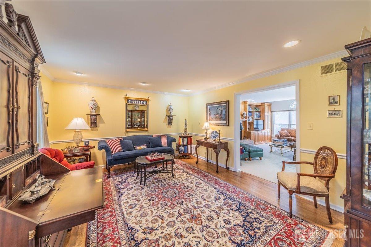 12 Adams Road Kendall Park, NJ 08824 - Photo 10 of 40 a living room with furniture and a rug