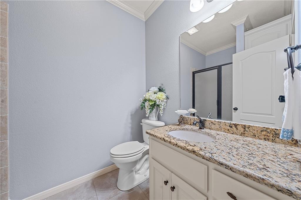 32 North Shore Circle Waco, TX 76708 - Photo 17 of 26 a bathroom with a granite countertop sink a toilet and a mirror