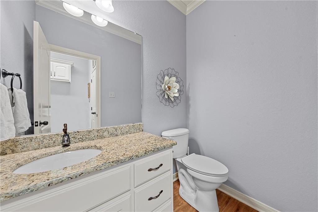 32 North Shore Circle Waco, TX 76708 - Photo 20 of 26 a bathroom with a granite countertop toilet sink and mirror