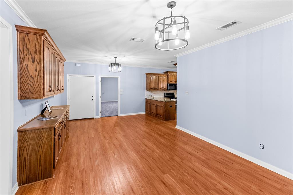 32 North Shore Circle Waco, TX 76708 - Photo 10 of 26 a view of a kitchen with a sink and wooden floor
