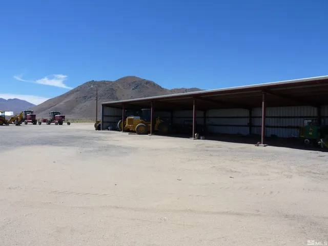 a view of a house with a large parking space