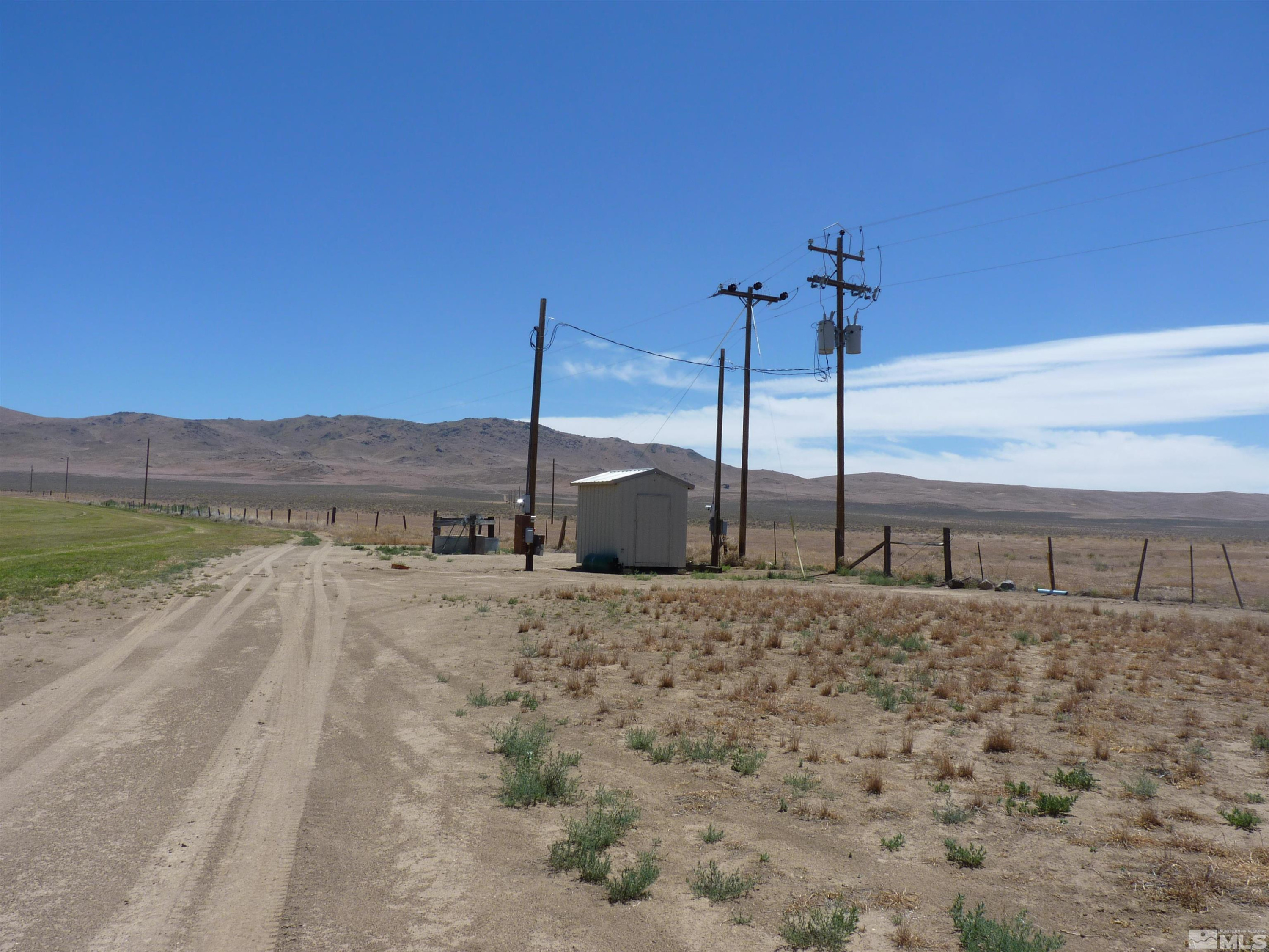 51955 Wilder Creek Road Denio, NV 89404 - Photo 27 of 36 a view of a dry yard with a house