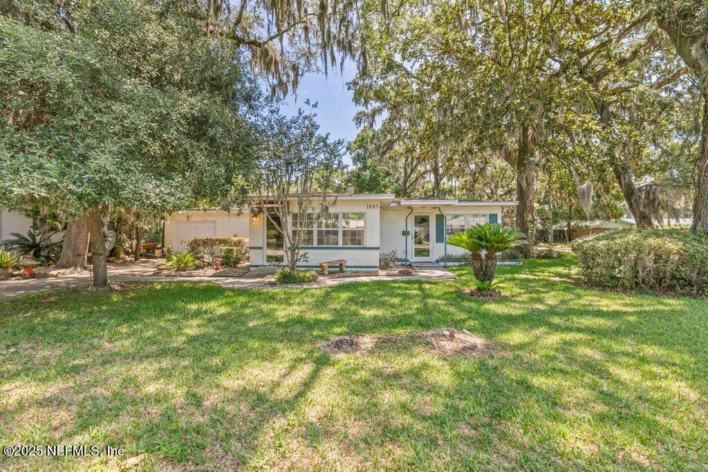 1445 Somerville Road Jacksonville, FL 32207 - Photo 1 of 49 a view of a house with a big yard