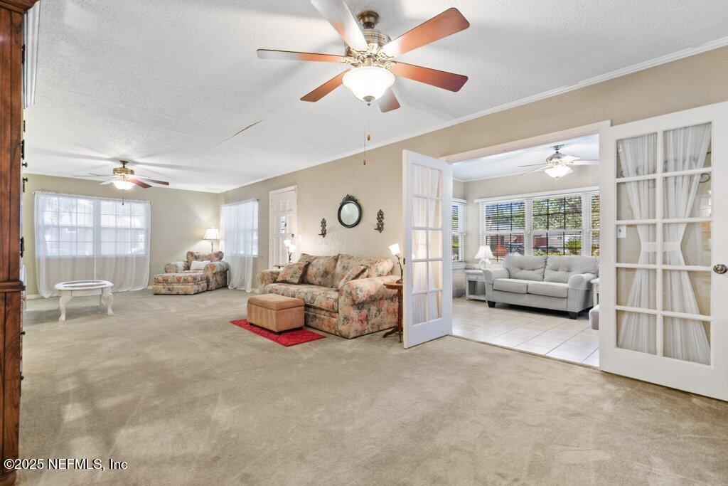 1445 Somerville Road Jacksonville, FL 32207 - Photo 14 of 49 a bedroom with furniture and a large window