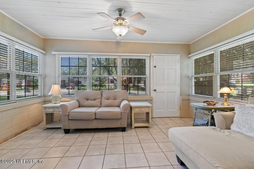 1445 Somerville Road Jacksonville, FL 32207 - Photo 17 of 49 a living room with furniture and floor to ceiling windows
