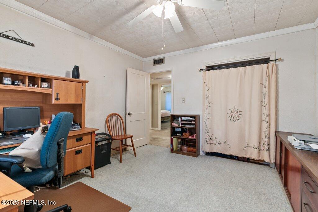 1445 Somerville Road Jacksonville, FL 32207 - Photo 28 of 49 a view of a workspace with furniture and a window