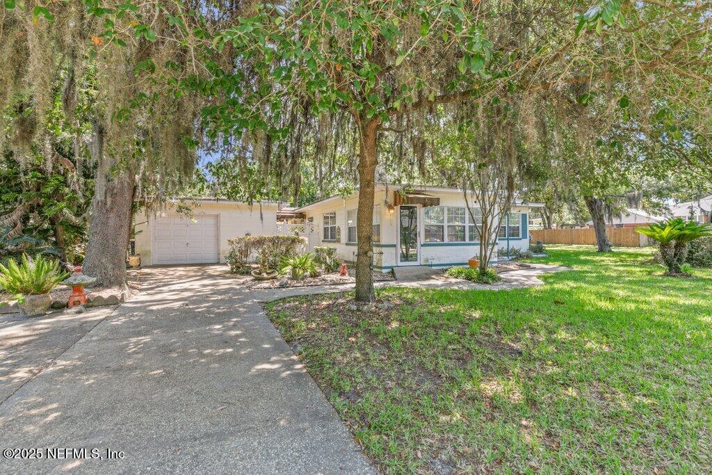 1445 Somerville Road Jacksonville, FL 32207 - Photo 3 of 49 a view of a house with backyard and a tree