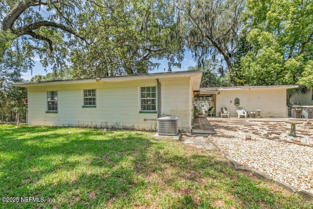 1445 Somerville Road Jacksonville, FL 32207 - Photo 48 of 49 a backyard of a house with table and chairs