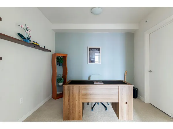 a bathroom with a toilet a sink a mirror and vanity