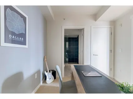 a bathroom with a sink mirror and shower
