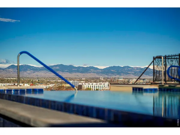 a view of a lake with a house in the background