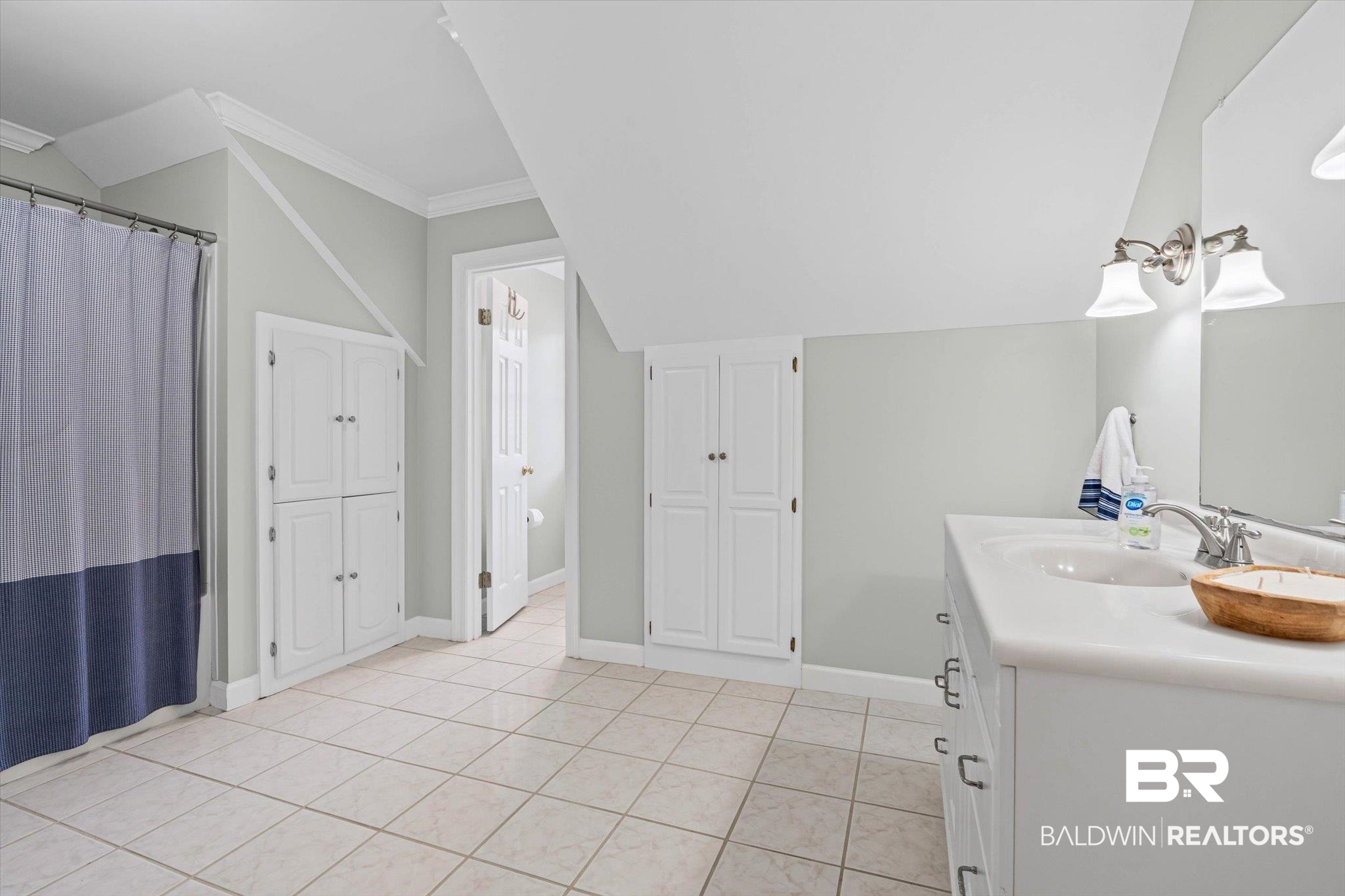 4851 Audubon Drive Mobile, AL 36619 - Photo 20 of 46 Full bathroom with vanity, a shower with shower curtain, ornamental molding, light tile patterned floors, and a closet