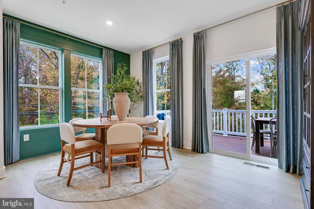 a bedroom with a bed and painting on the wall