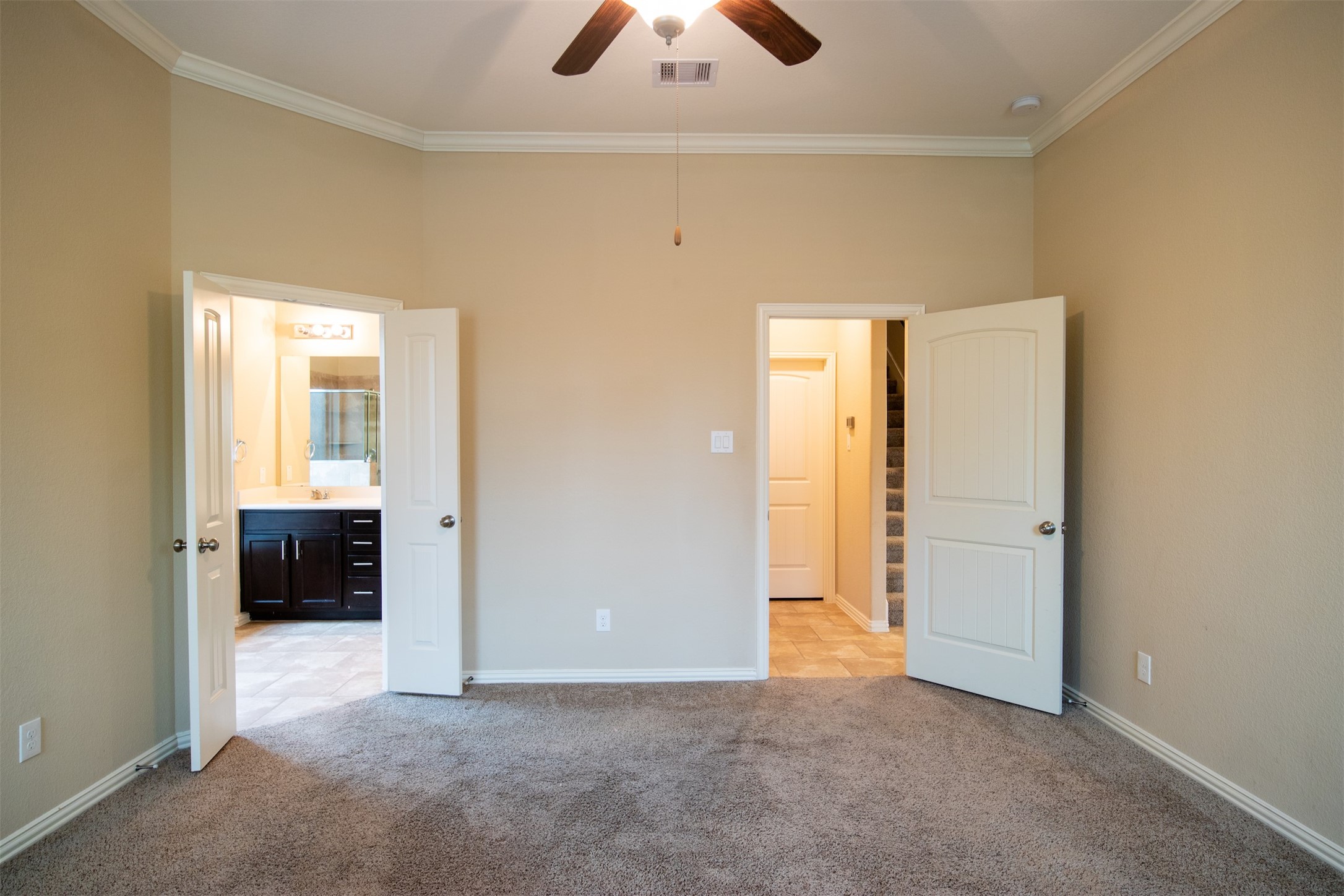 7042 Bristol Memorial Drive Spring, TX 77379 - Photo 13 of 21 an empty room with closet and a chandelier fan