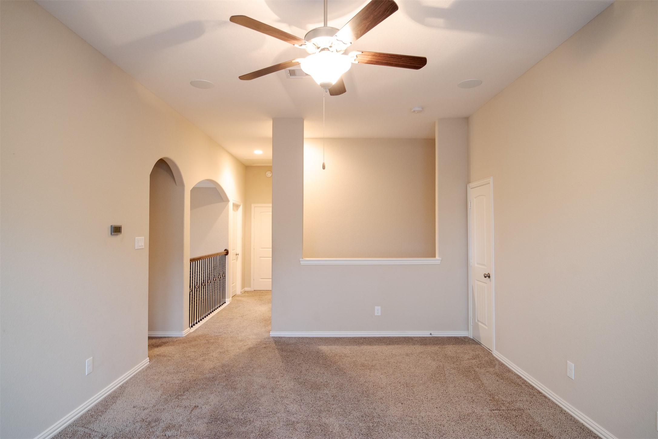 7042 Bristol Memorial Drive Spring, TX 77379 - Photo 15 of 21 wooden floor in an empty room with a window