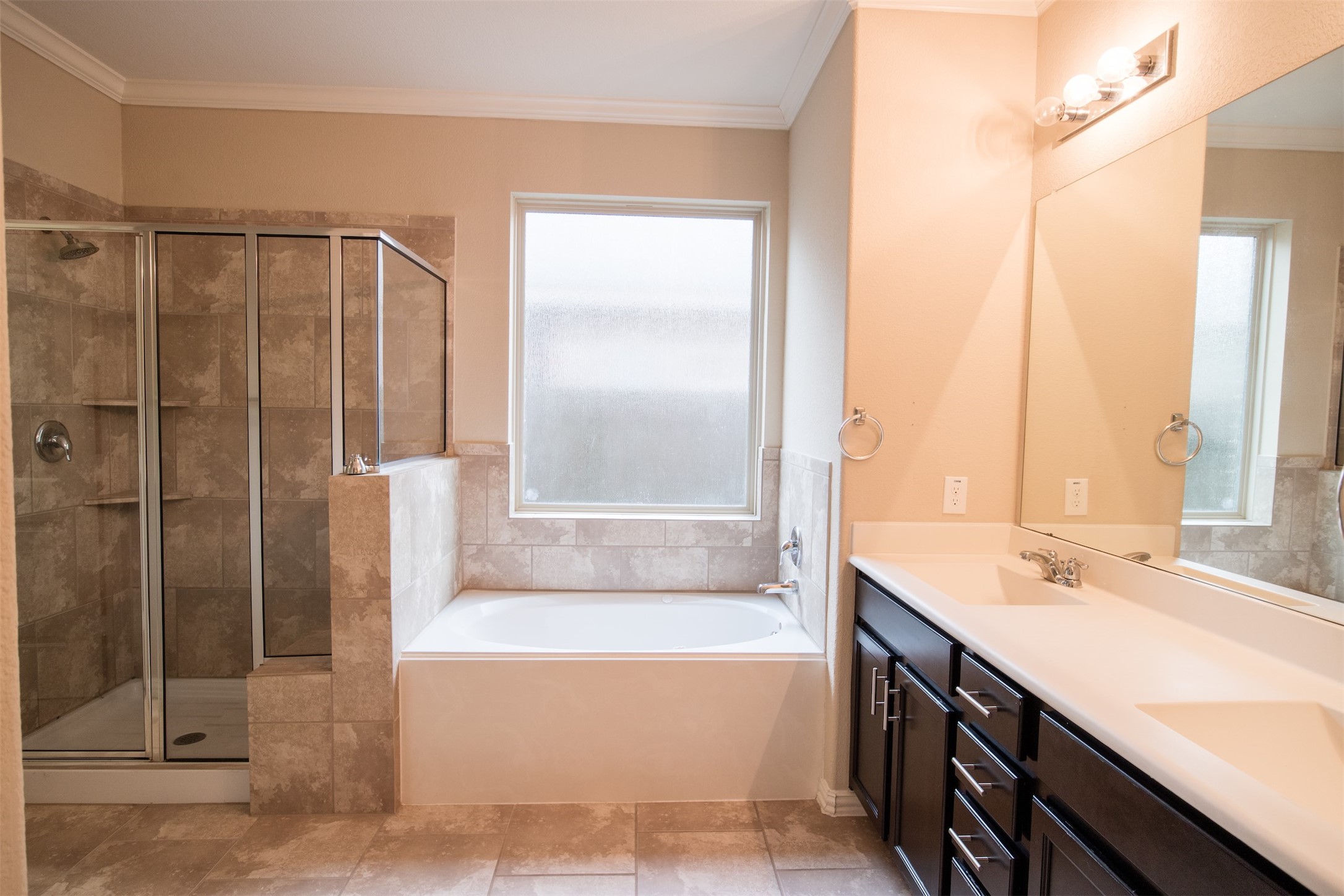 7042 Bristol Memorial Drive Spring, TX 77379 - Photo 16 of 21 a bathroom with a tub sink and shower