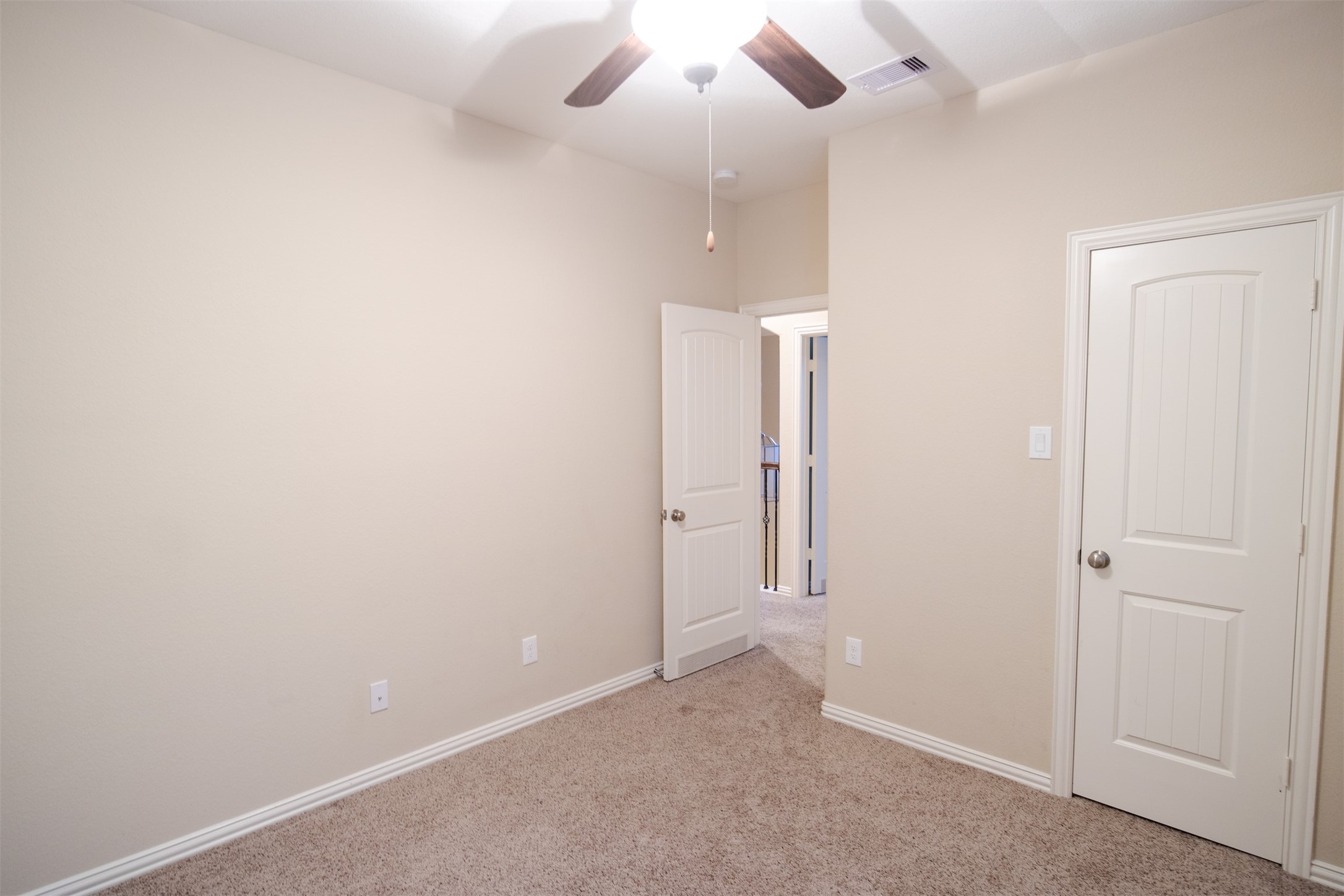 7042 Bristol Memorial Drive Spring, TX 77379 - Photo 17 of 21 an empty room with chandelier fan