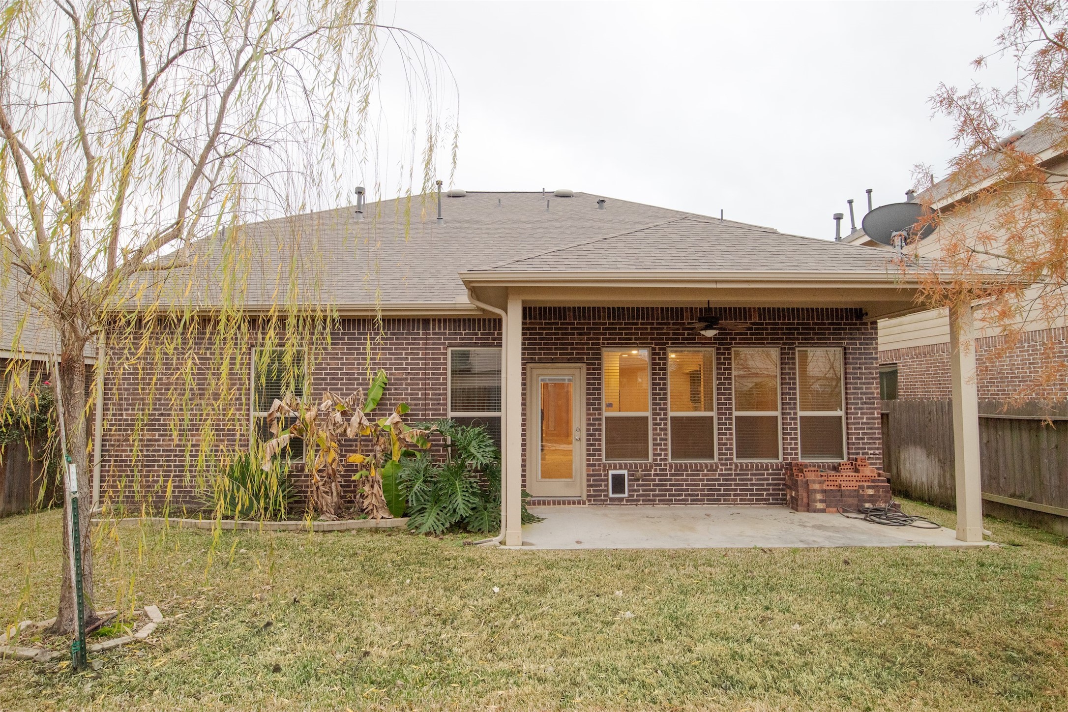 7042 Bristol Memorial Drive Spring, TX 77379 - Photo 18 of 21 a front view of a house with garden