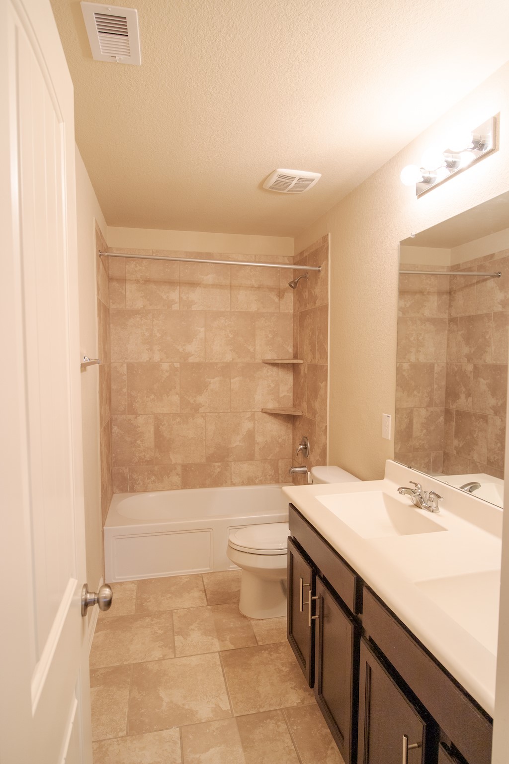 7042 Bristol Memorial Drive Spring, TX 77379 - Photo 19 of 21 a bathroom with a granite countertop sink a toilet and bathtub