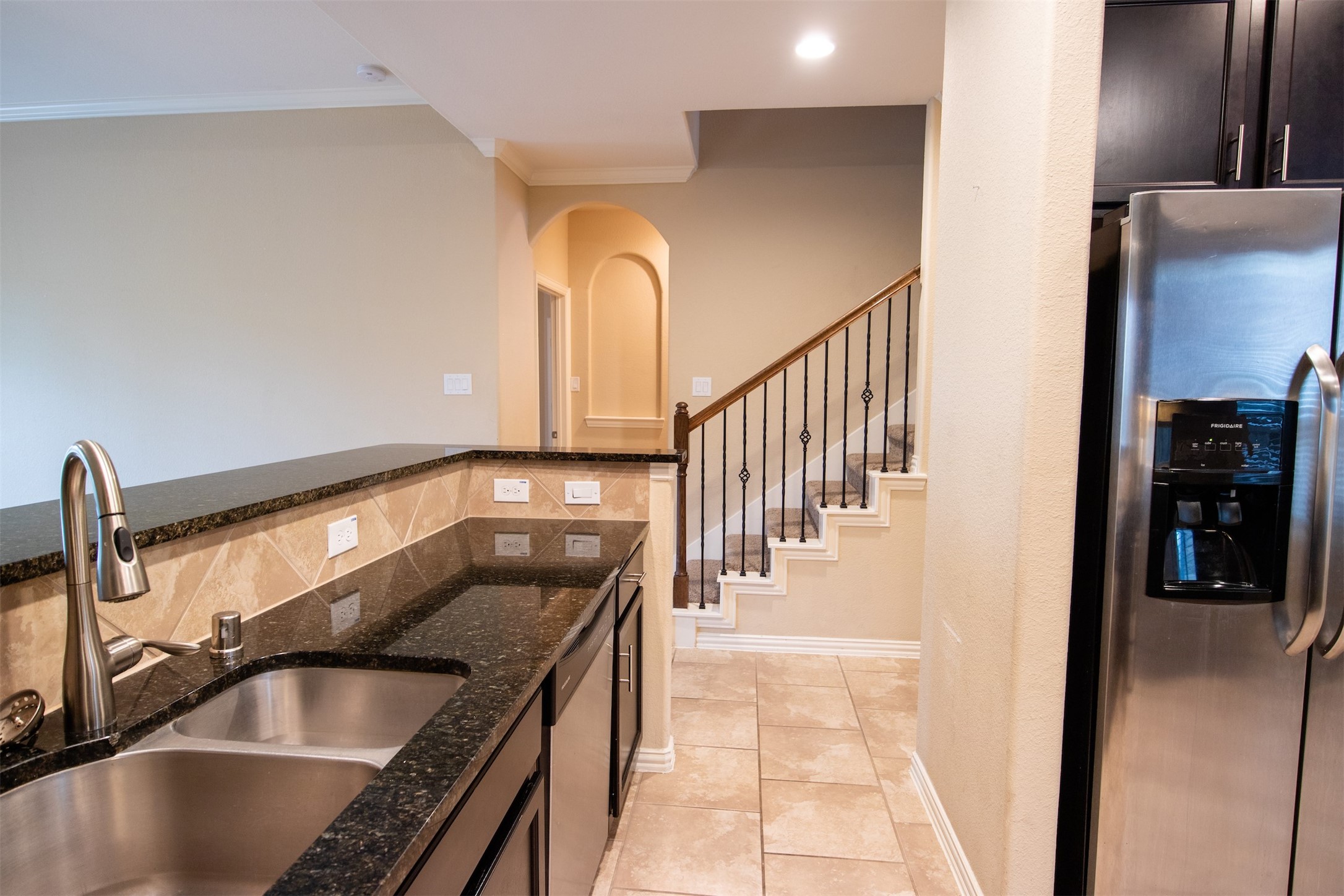 7042 Bristol Memorial Drive Spring, TX 77379 - Photo 4 of 21 a view of a kitchen counter space and staircase