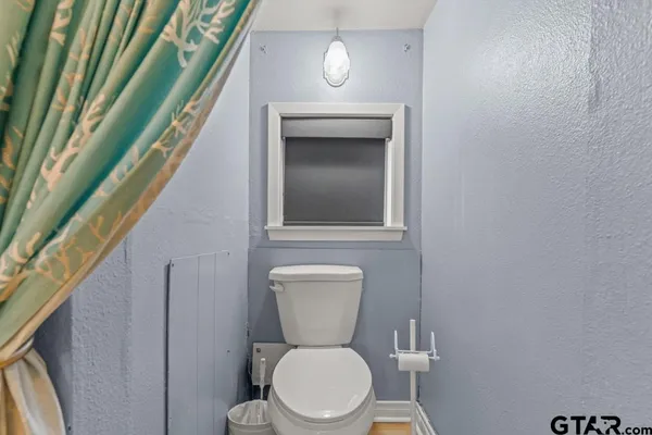 a bathroom with a toilet and a sink