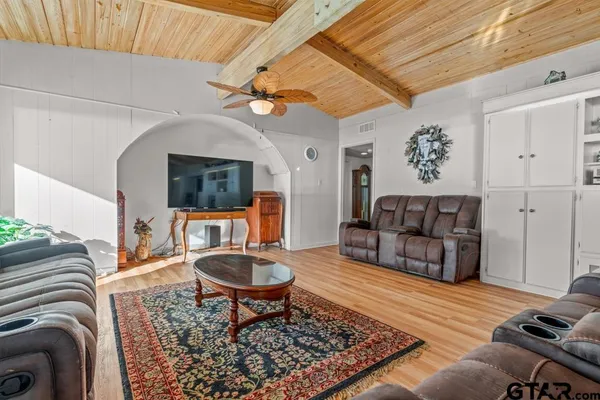 a living room with furniture and a rug