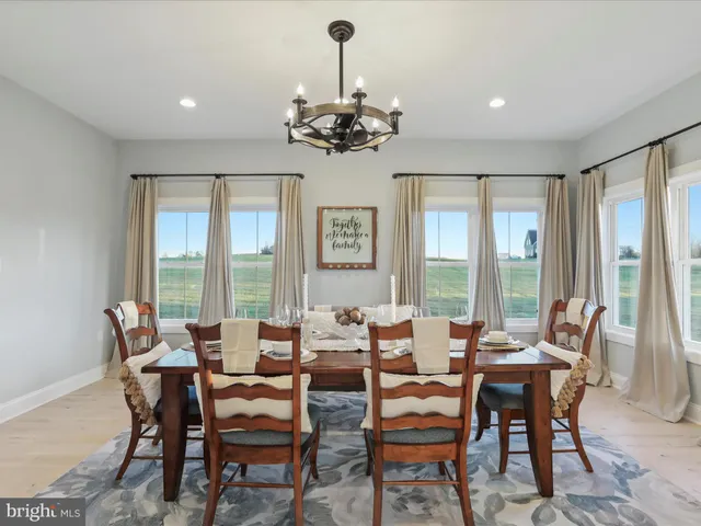 a bedroom with bed and a chandelier