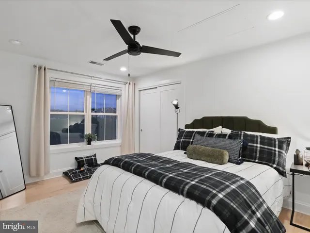 a bedroom with a bed and a walk in closet