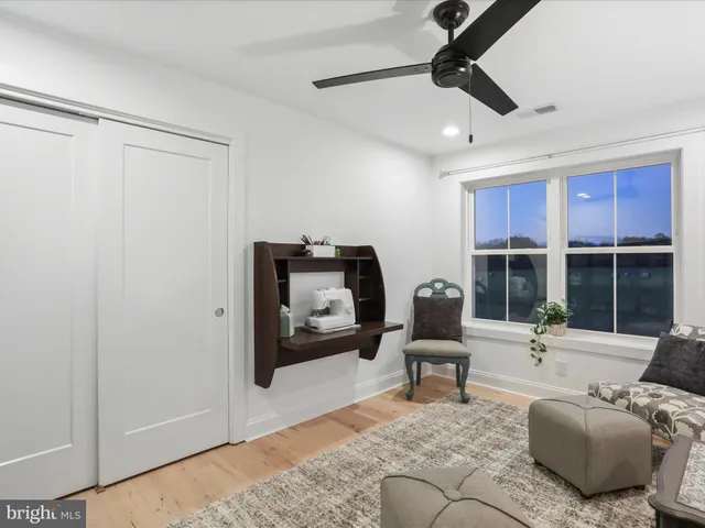 a kitchen with kitchen island a sink stove and refrigerator