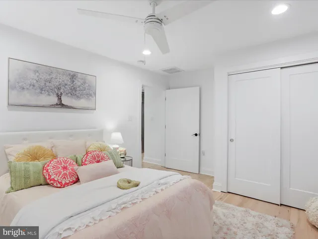 a bedroom with furniture and a window