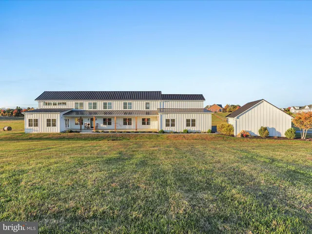 a view of a house with a big yard
