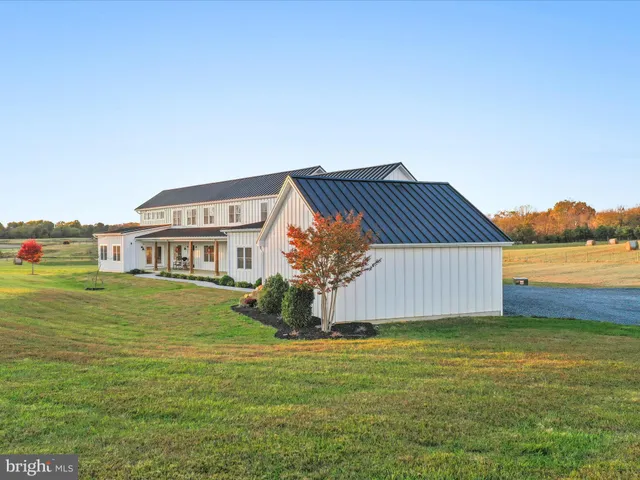 a house view with a big yard