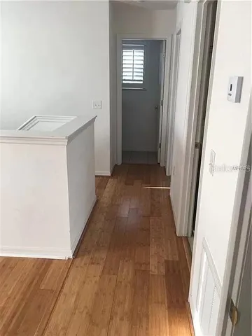a view of entryway with wooden floor