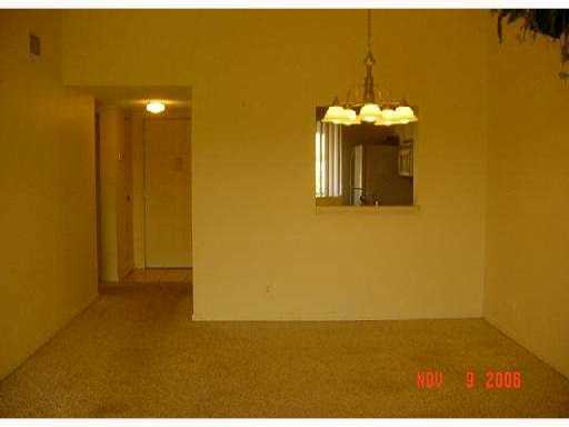 21943 Remsen Terrace, Unit 204C Boca Raton, FL 33433 - Photo 5 of 7 a view of a room with wooden floor