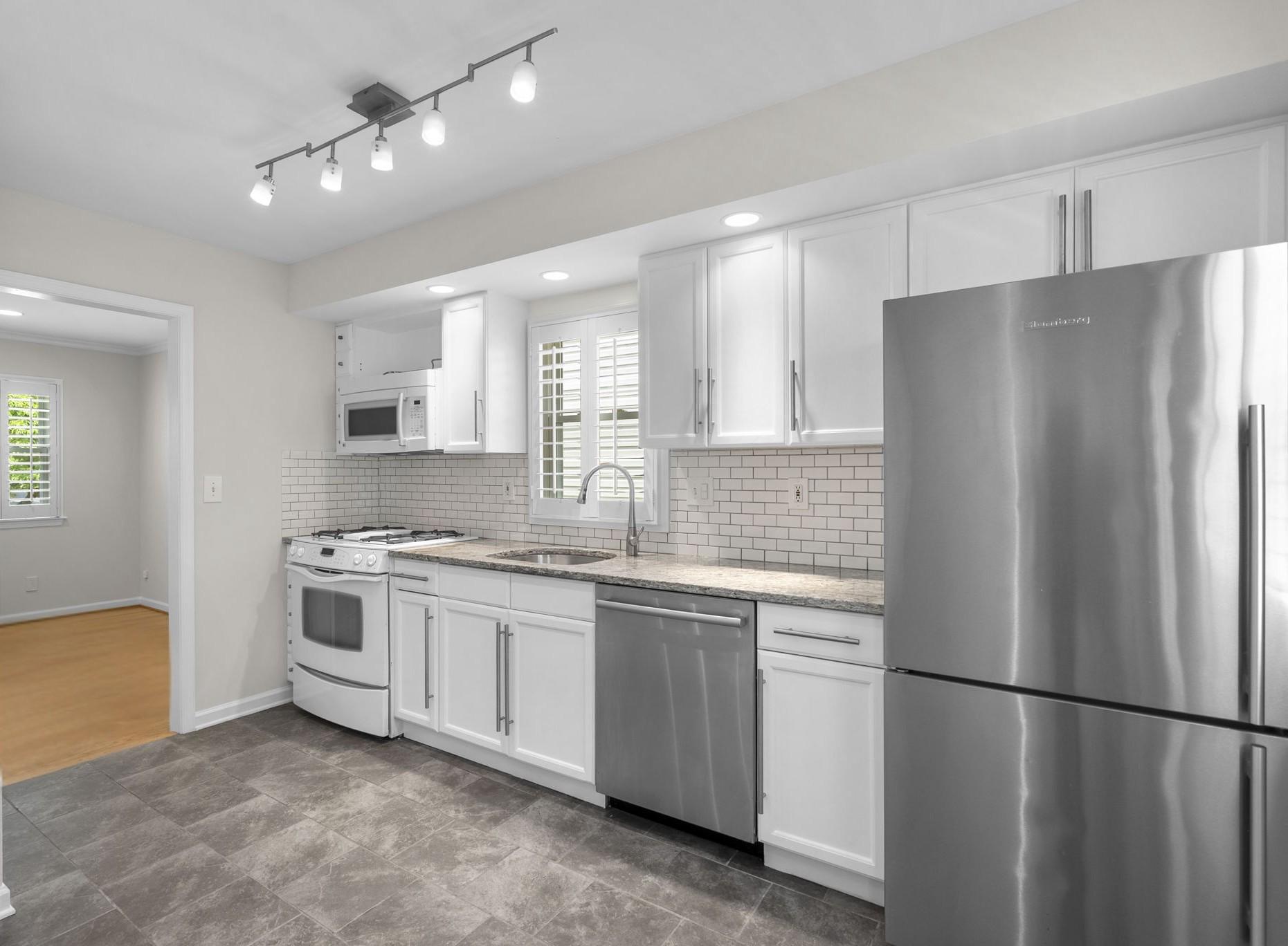 513 Park Road Rockville, MD 20850 - Photo 9 of 43 Sleek White Cabinetry and Ample Workspace