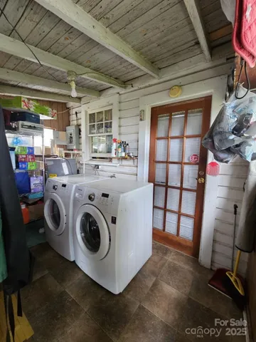 a bed room with a bed and a chandelier