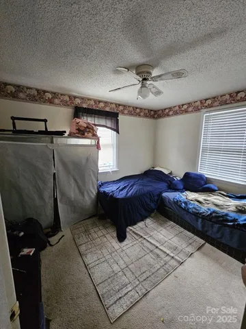 a kitchen with sink cabinets and stove top oven