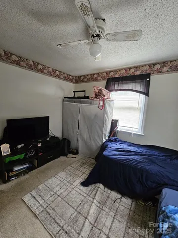 a kitchen with a stove a sink and a refrigerator