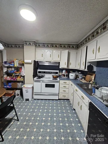 a bathroom with a sink mirror and shower