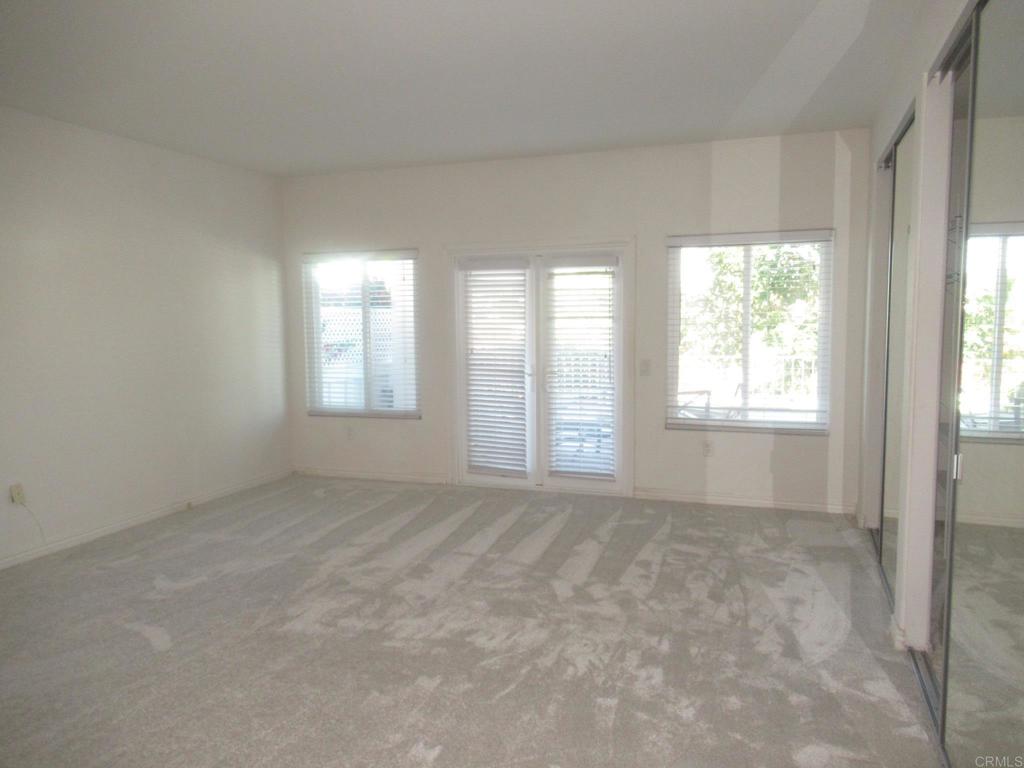 4143 Andros Way Oceanside, CA 92056 - Photo 14 of 34 a view of an empty room with a window