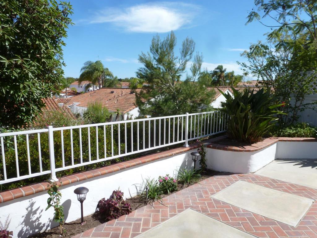 4143 Andros Way Oceanside, CA 92056 - Photo 22 of 34 a view of balcony with wooden floor and outdoor seating