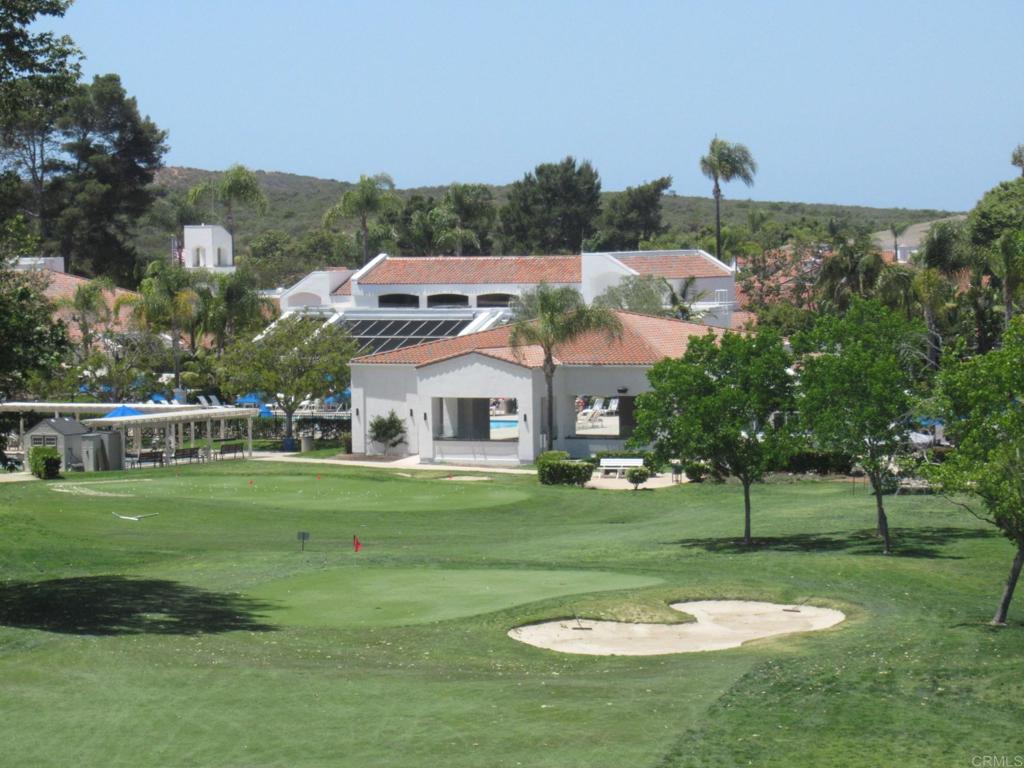4143 Andros Way Oceanside, CA 92056 - Photo 28 of 34 a view of a white house in a big yard with a big yard and plants