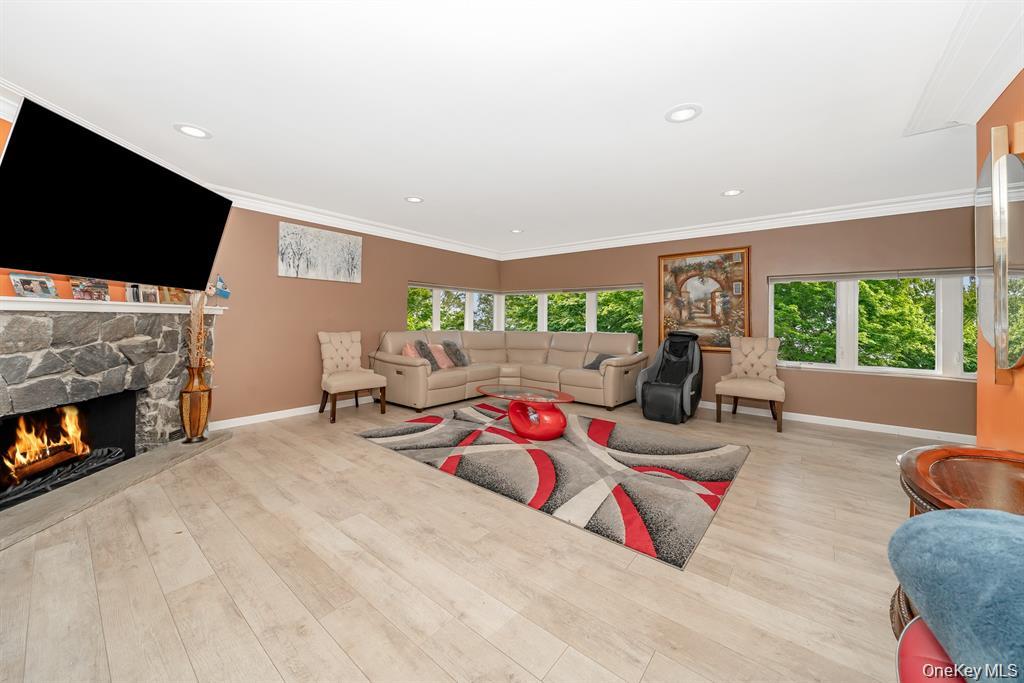 28 Riverside Avenue Amityville, NY 11701 - Photo 12 of 31 a bedroom with furniture and a flat screen tv