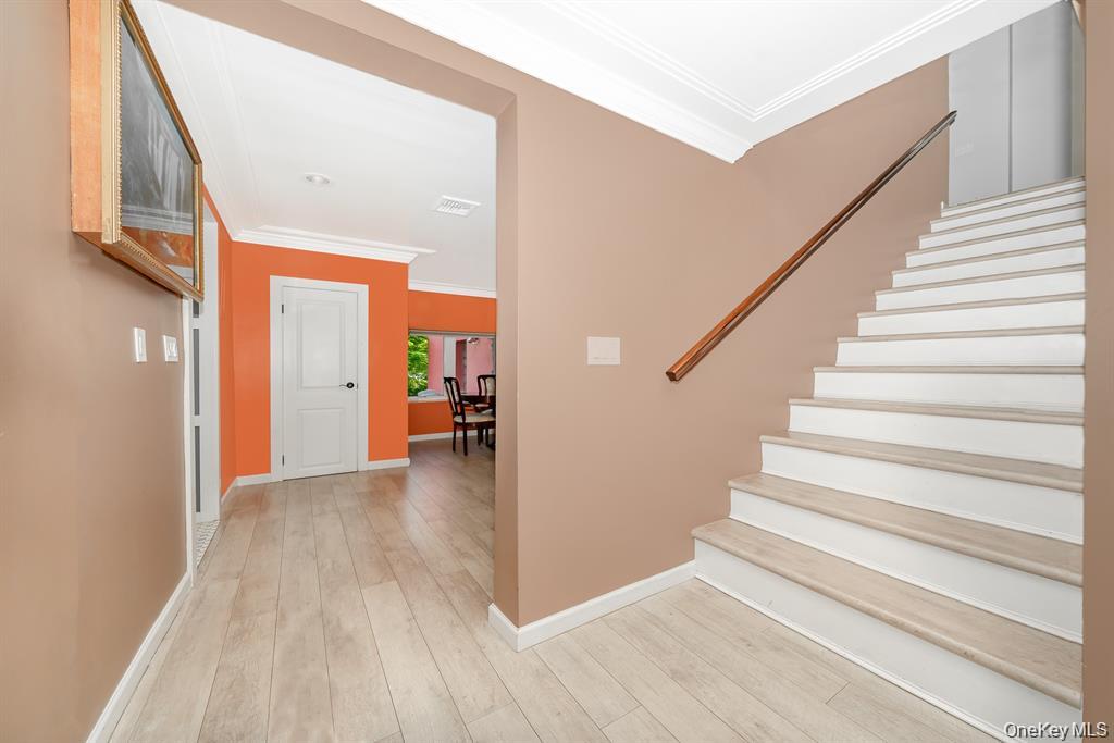 28 Riverside Avenue Amityville, NY 11701 - Photo 14 of 31 a view of an entryway with wooden floor