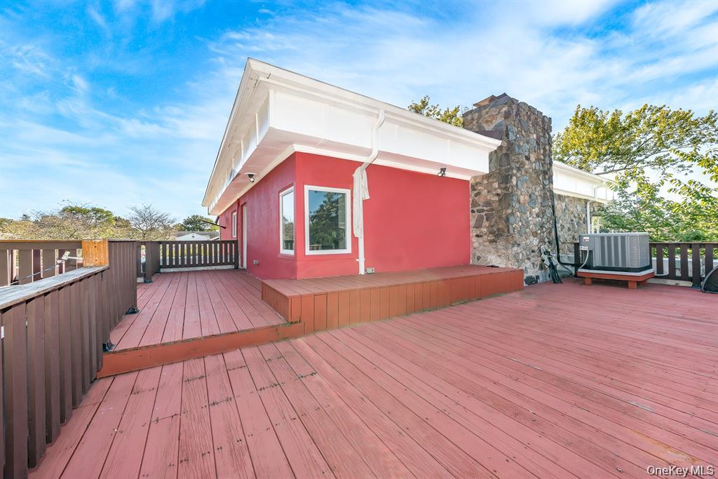 28 Riverside Avenue Amityville, NY 11701 - Photo 26 of 31 a view of a house with a patio