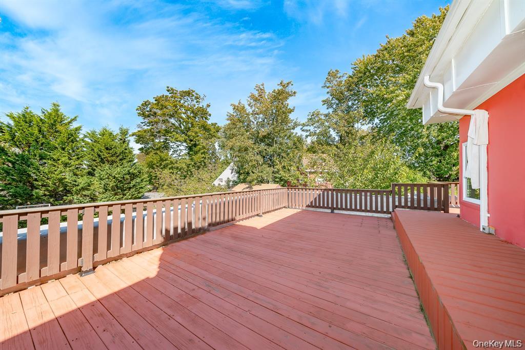 28 Riverside Avenue Amityville, NY 11701 - Photo 27 of 31 a view of balcony with wooden floor and fence