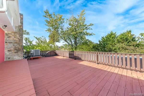 a balcony with trees in front of it