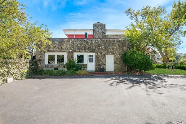 a front view of a house with a yard and a garage