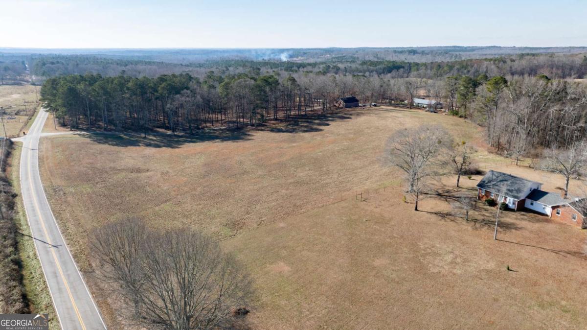 0 Old Centerpoint Road Carrollton, GA 30117 - Photo 5 of 11 a view of a road with wooden fence