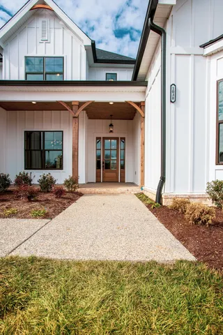 a view of a house with backyard and windows
